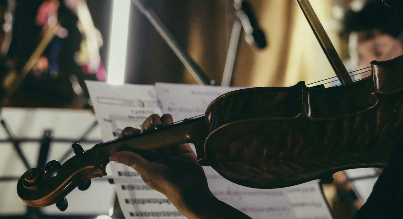 Closeup of violinist playing in a studio